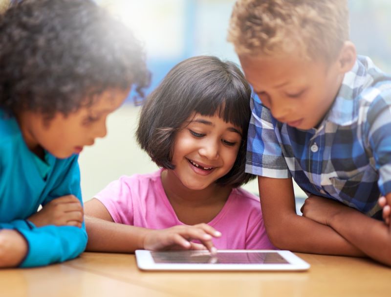kids looking at tablet