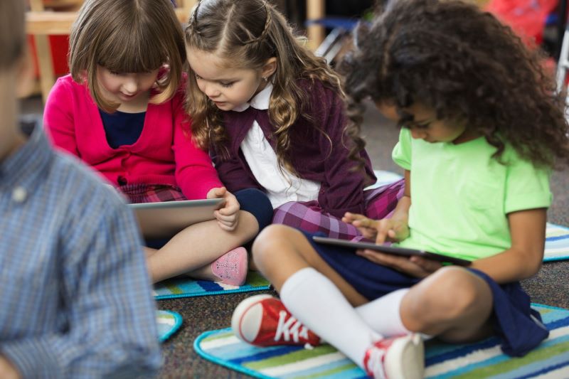 kids looking at tablet