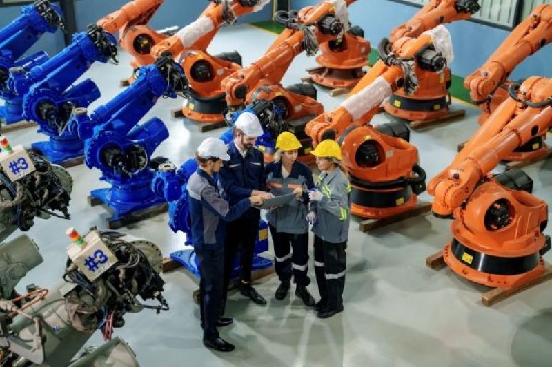 workers with manufacturing machinery