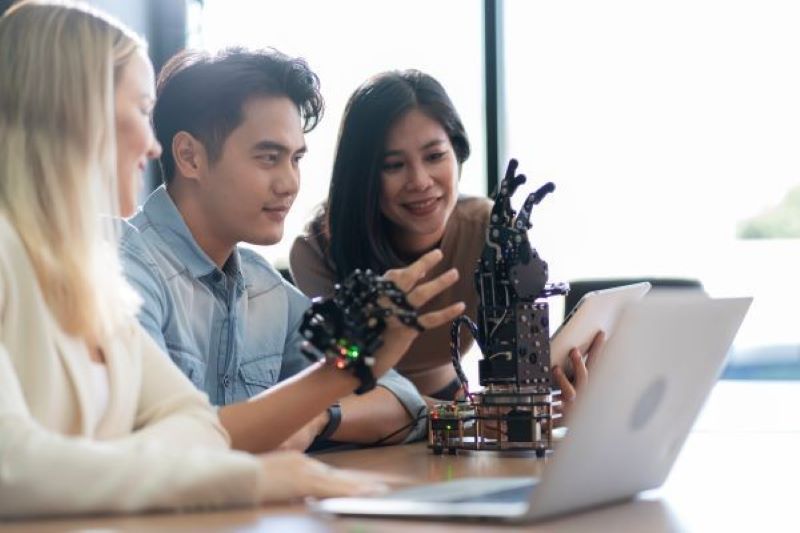 students looking at their macbook