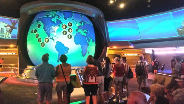 people staring at giant tv