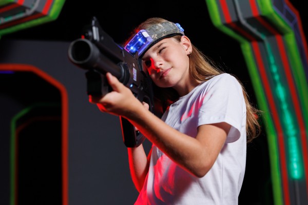kid holding laser gun