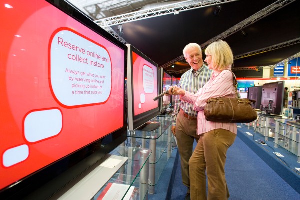 elderly couple stares at tv