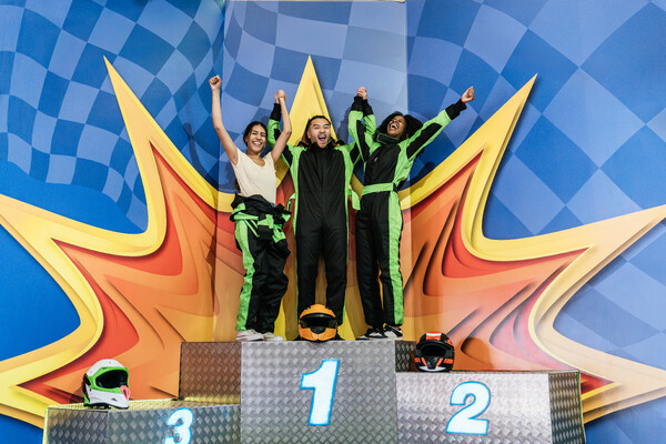 three people winning a prize