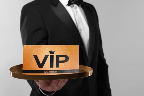 man holding vip card